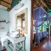 Kosi-Forest-Lodge-Indoor-Bathroom-into-Bedroom-set-as-twin Kosi-Forest-Lodge-Indoor-Bathroom-into-Bedroom-set-as-twin